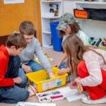 Students at Lafayette Elementary School prepare for the robotics competition by building sets and coding robots.